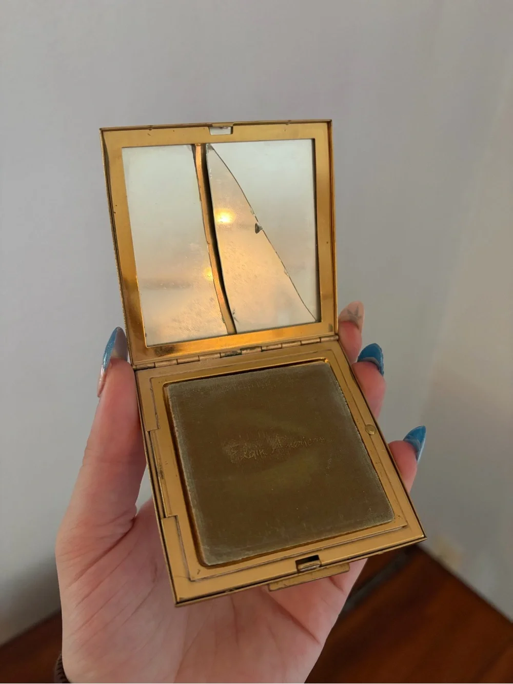 vintage Elgin American gold powder compact with an etched floral design